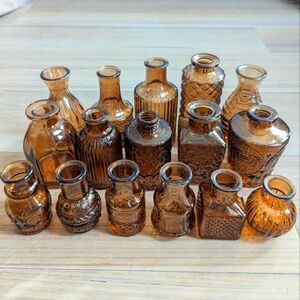 16 assorted amber bud vases